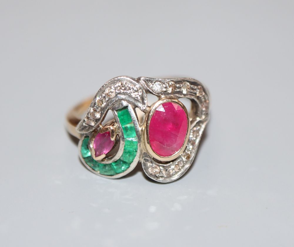 A modern 14k, ruby, emerald and diamond set dress ring, size J, gross 3.1 grams.